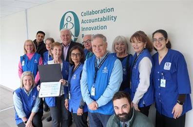 group of QCH volunteers smiling