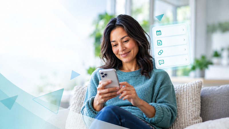 Photo of a woman looking at her iPhone.