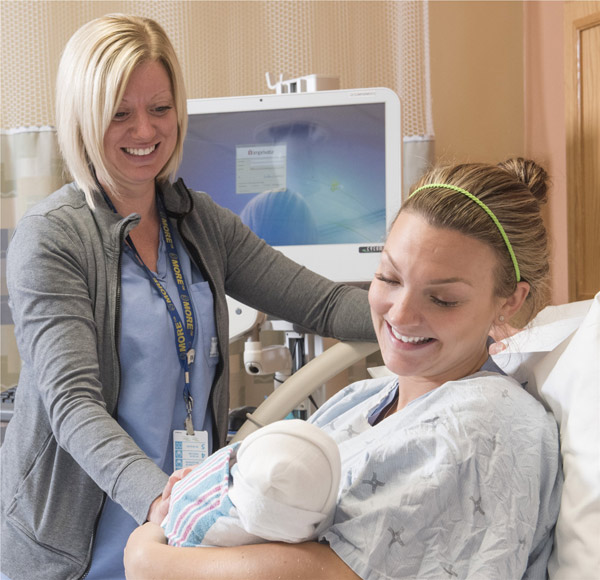 Nurse with patient and baby