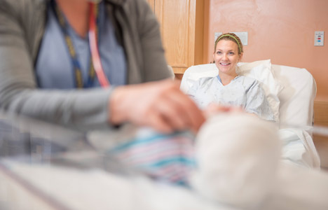 woman smiling at nurse